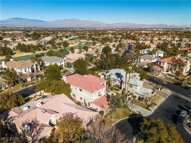 birds eye view of property with a mountain view