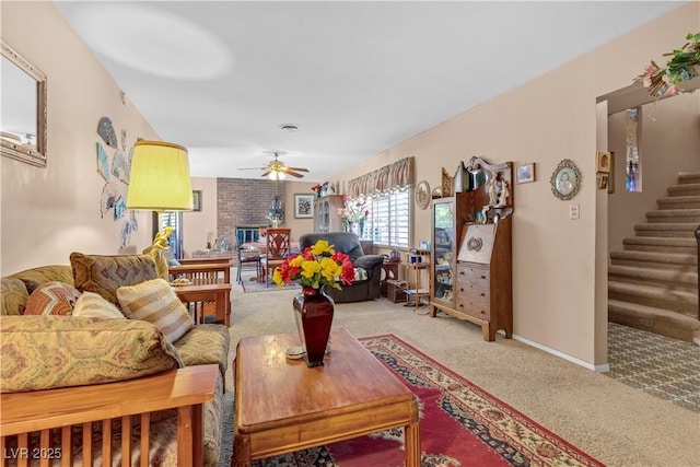 carpeted living room with ceiling fan