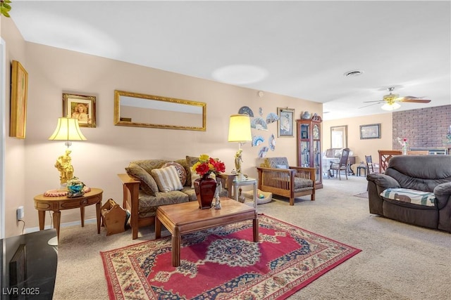 living room with ceiling fan and carpet flooring