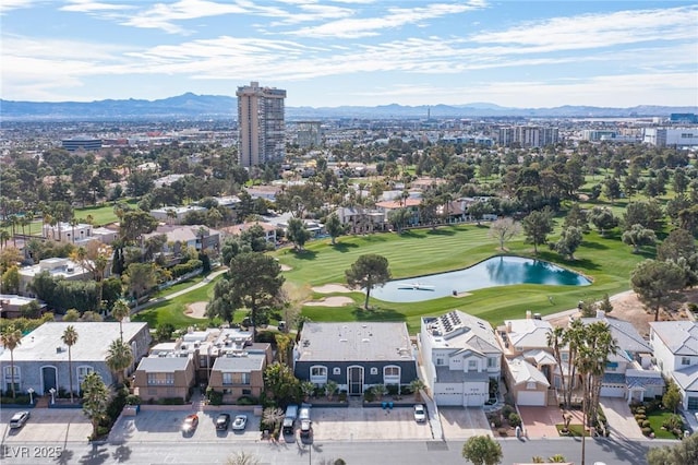 drone / aerial view featuring a water and mountain view