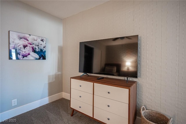 bedroom featuring dark colored carpet