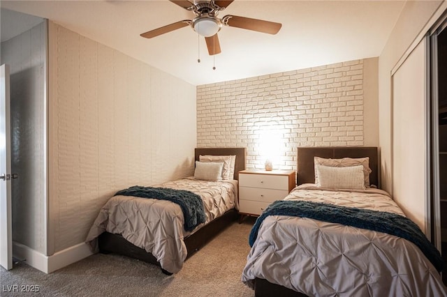 bedroom featuring ceiling fan and carpet