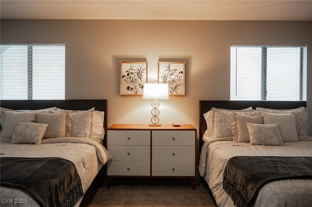 bedroom with dark carpet