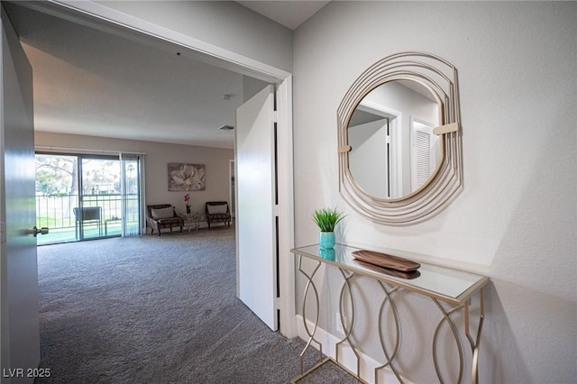 hallway featuring carpet flooring