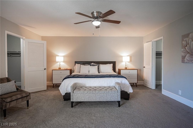 bedroom featuring carpet floors, ceiling fan, a spacious closet, and a closet