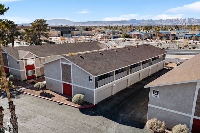 birds eye view of property featuring a mountain view