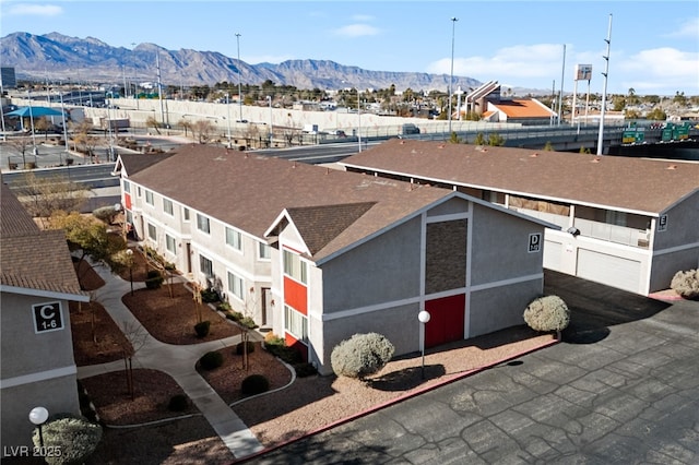 birds eye view of property featuring a mountain view