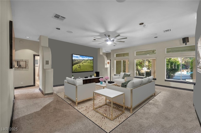 living room featuring ceiling fan and light carpet