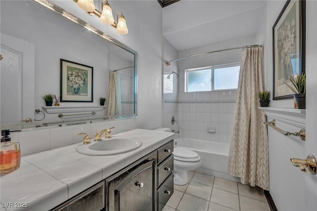 full bathroom featuring toilet, shower / bath combo with shower curtain, tile patterned floors, and vanity