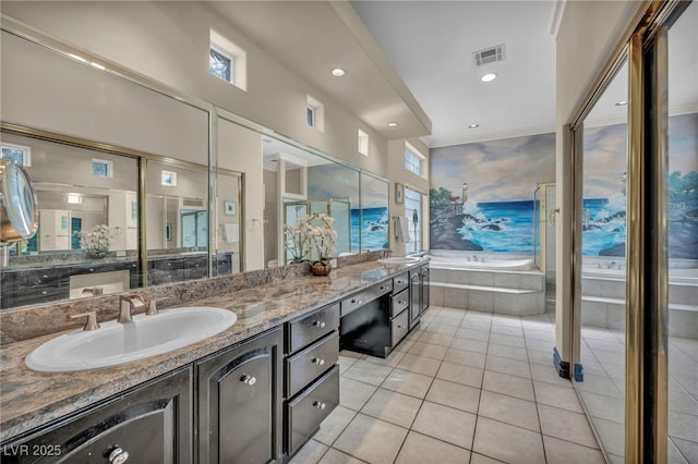 bathroom with tiled bath, tile patterned flooring, ornamental molding, and vanity