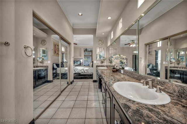 bathroom featuring ceiling fan, tile patterned flooring, crown molding, and vanity