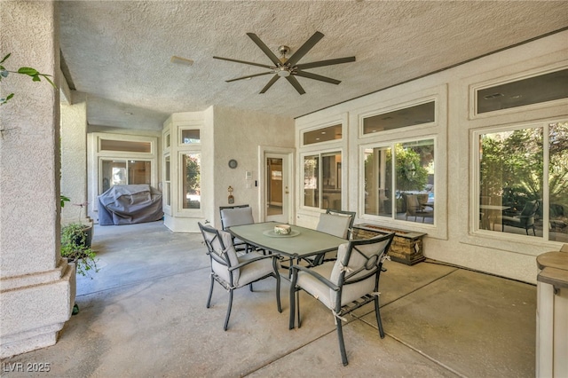 view of patio / terrace with ceiling fan and area for grilling