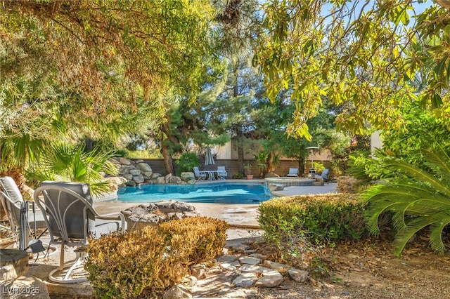 view of swimming pool with a patio