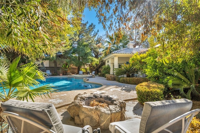 view of swimming pool featuring a patio area