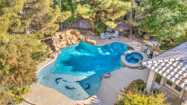 view of swimming pool featuring a pergola, a patio, and an in ground hot tub