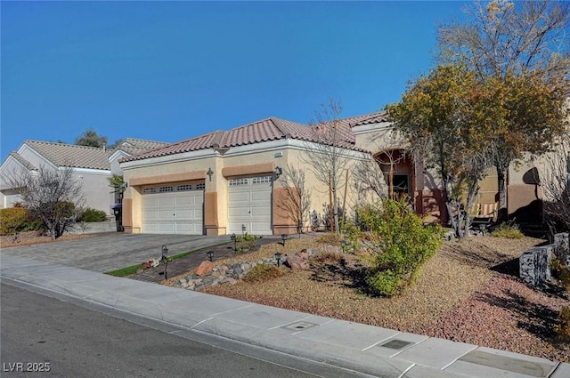 mediterranean / spanish-style house featuring a garage