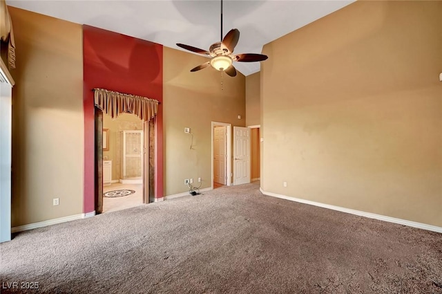 interior space with high vaulted ceiling, ceiling fan, and carpet