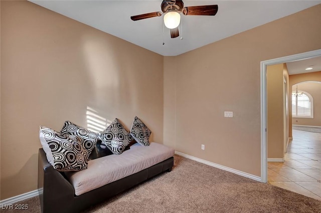 sitting room featuring ceiling fan and light tile patterned floors