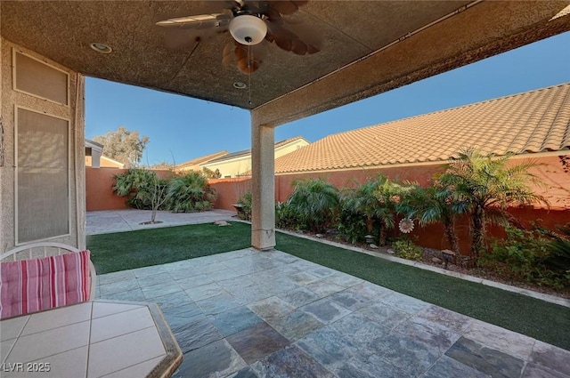 view of patio / terrace featuring ceiling fan