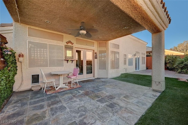 view of patio with ceiling fan and french doors