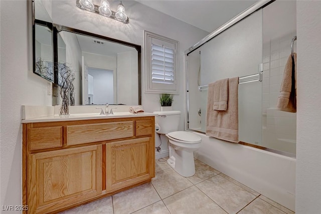 full bathroom with toilet, tile patterned floors, vanity, and enclosed tub / shower combo