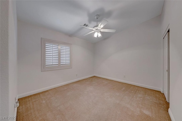 carpeted empty room with ceiling fan