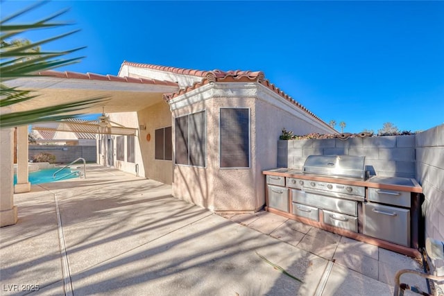 view of patio / terrace with an outdoor kitchen and area for grilling