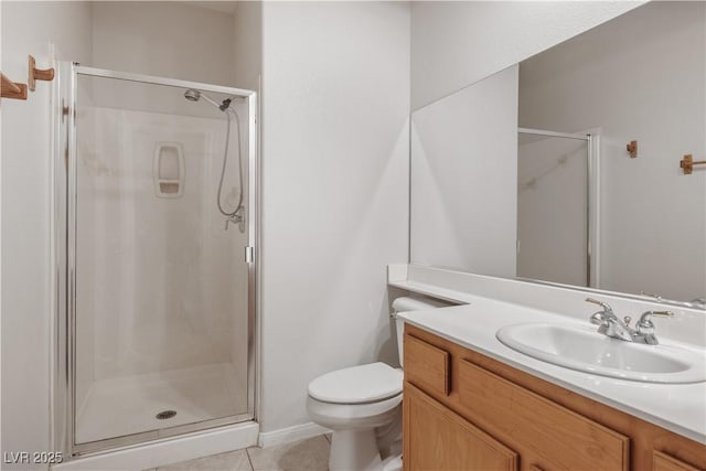 bathroom featuring vanity, toilet, tile patterned floors, and a shower with shower door