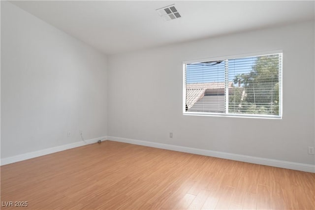 unfurnished room with light hardwood / wood-style floors