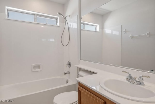 full bathroom featuring shower / bathing tub combination, vanity, and toilet