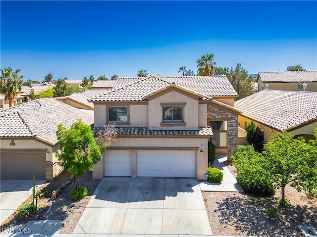 mediterranean / spanish-style home with a garage