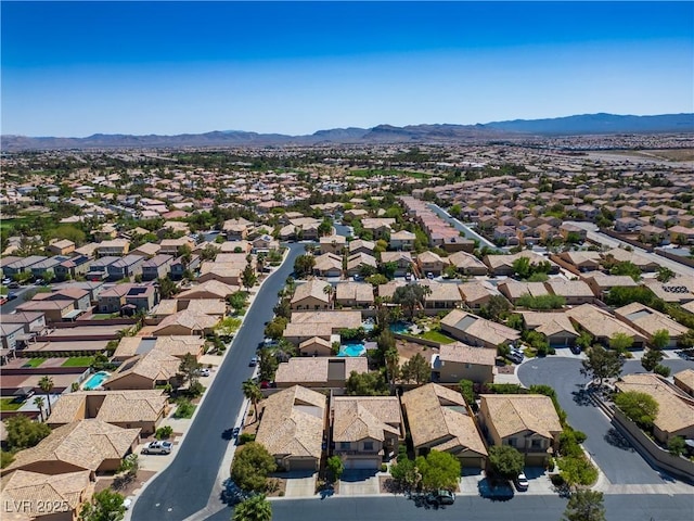 birds eye view of property featuring a mountain view