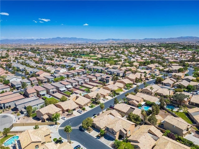 birds eye view of property with a mountain view