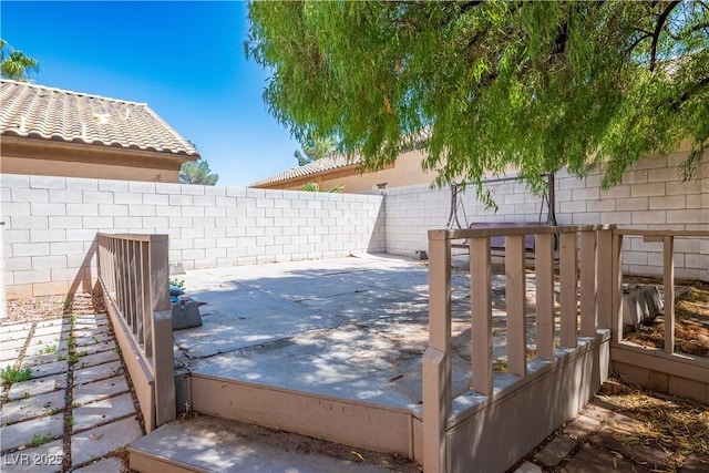 wooden deck with a patio