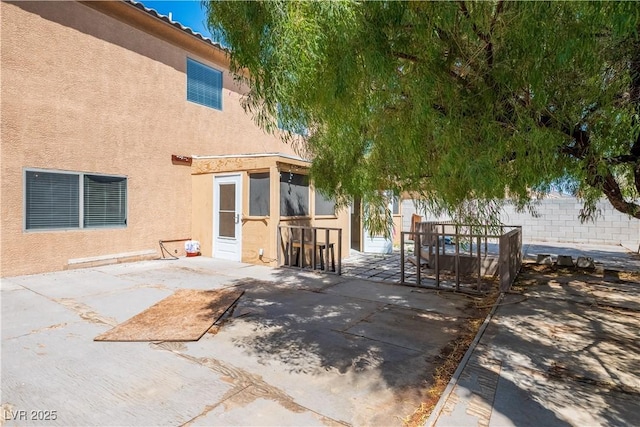 rear view of property with a patio