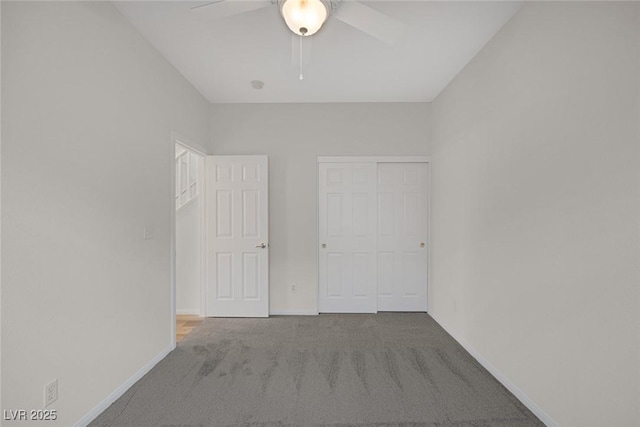 unfurnished bedroom featuring carpet floors, ceiling fan, and a closet