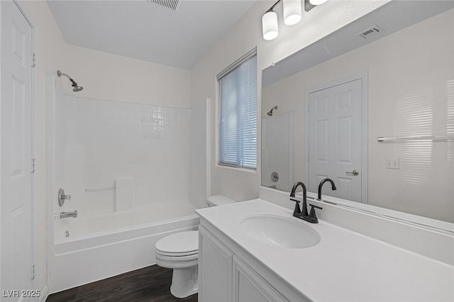 full bathroom featuring toilet, shower / bath combination, vanity, and hardwood / wood-style floors