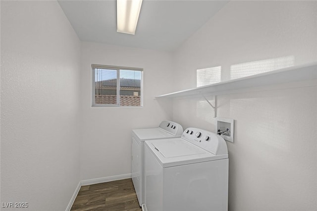 clothes washing area featuring washing machine and dryer and dark wood-type flooring