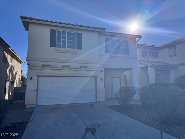 front of property with a garage