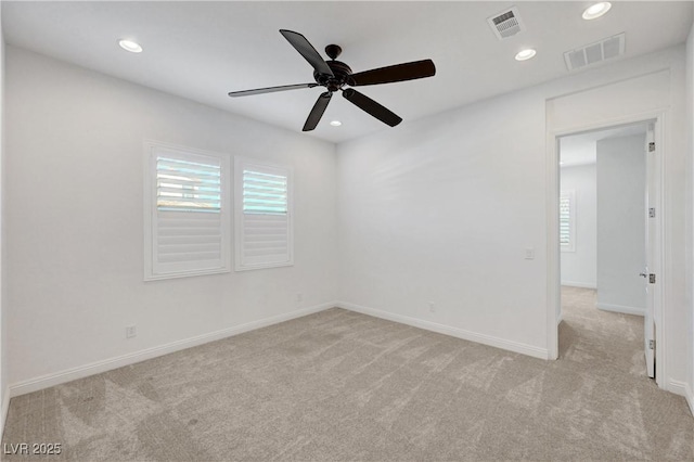 unfurnished room with light carpet and ceiling fan