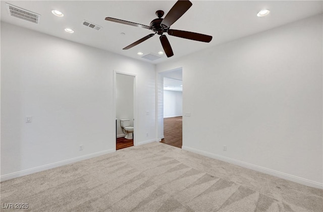 empty room with ceiling fan and carpet