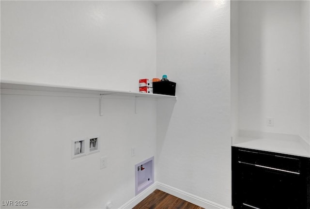 clothes washing area with dark wood-type flooring and hookup for a washing machine