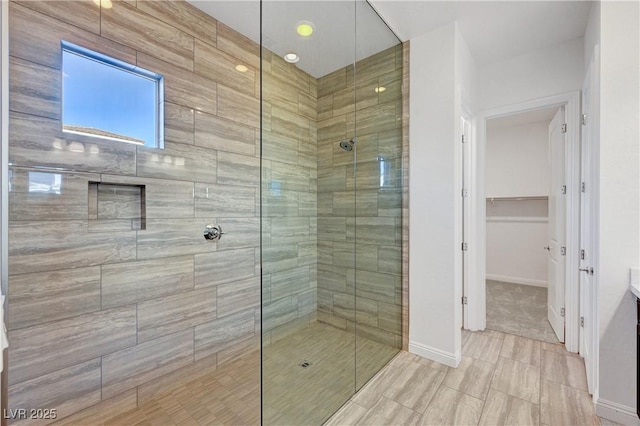 bathroom featuring an enclosed shower and vanity