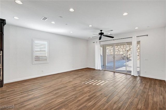 spare room featuring ceiling fan and a healthy amount of sunlight