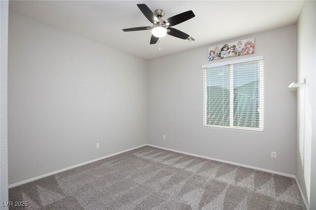 carpeted empty room featuring ceiling fan