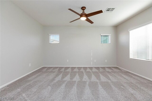 carpeted empty room with ceiling fan