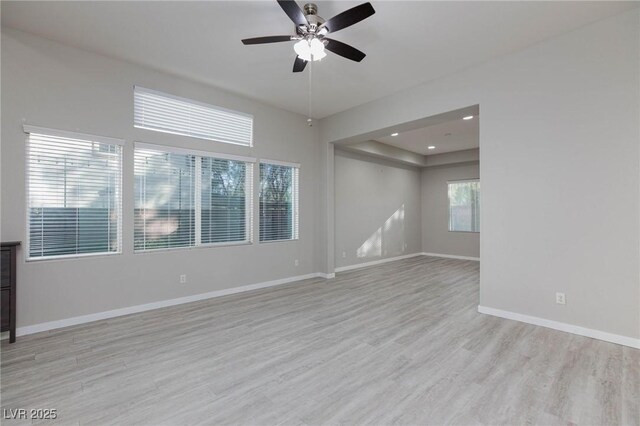 unfurnished room featuring ceiling fan and light hardwood / wood-style floors