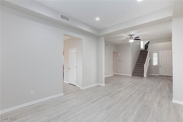 unfurnished room featuring light wood-type flooring and ceiling fan