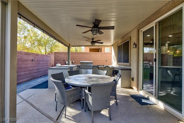 view of patio / terrace featuring ceiling fan, a grill, and area for grilling