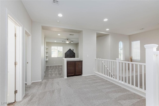 carpeted spare room with plenty of natural light